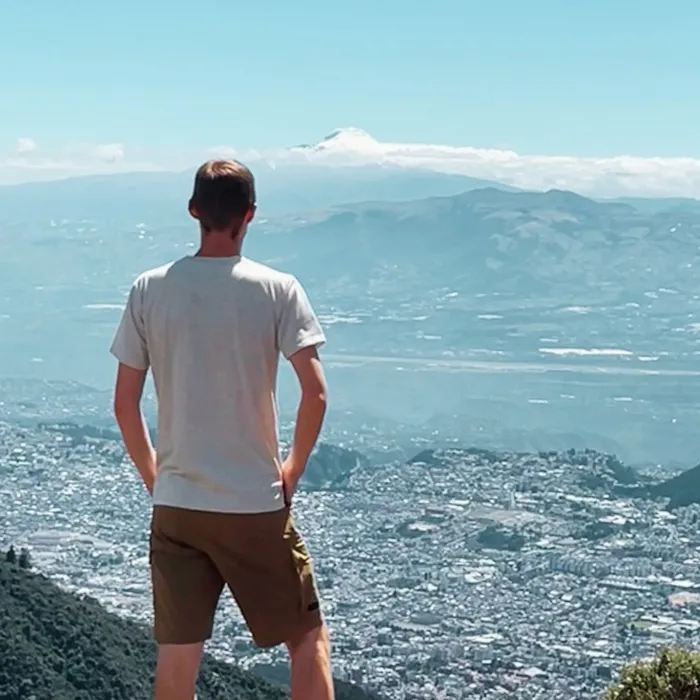 Josiah looking out over a mountain view
